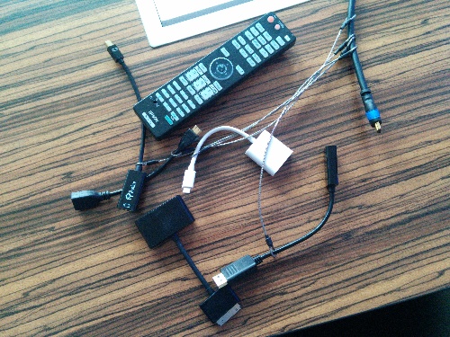 A set of adapters needed to plug in any computer to the projector